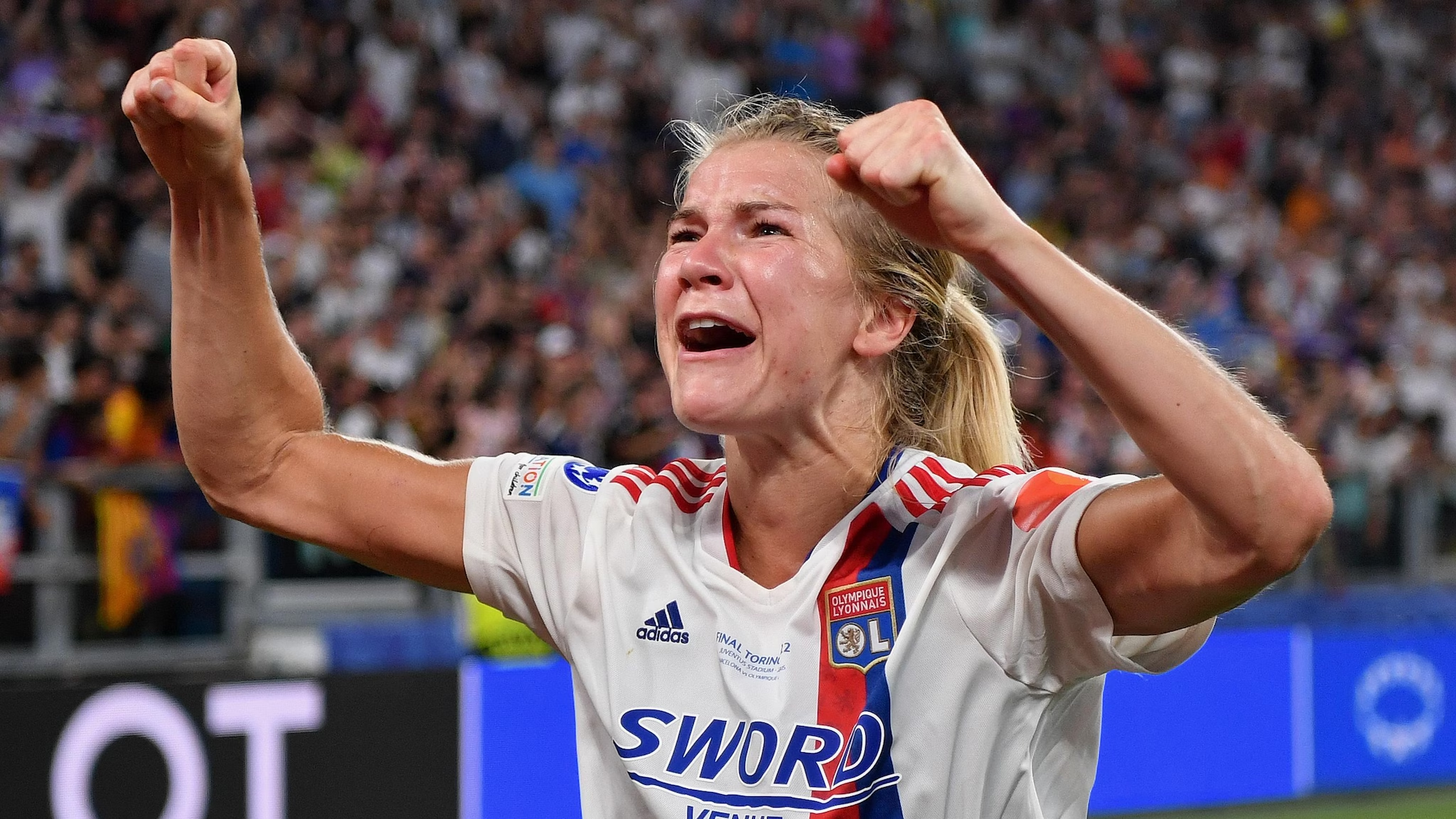 Ada Hegerberg scoring and Mapi Leon defending